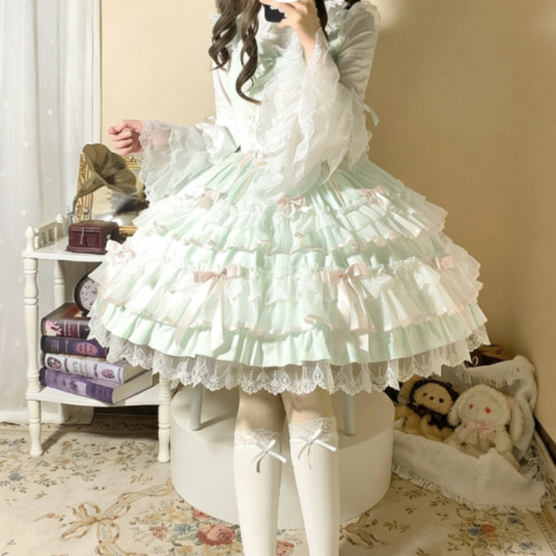 Robe Lolita aux nœuds papillons et dentelles douces disponible en rose vert et bleu