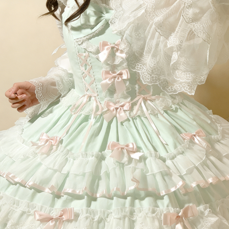 Robe Lolita aux nœuds papillons et dentelles douces disponible en rose vert et bleu